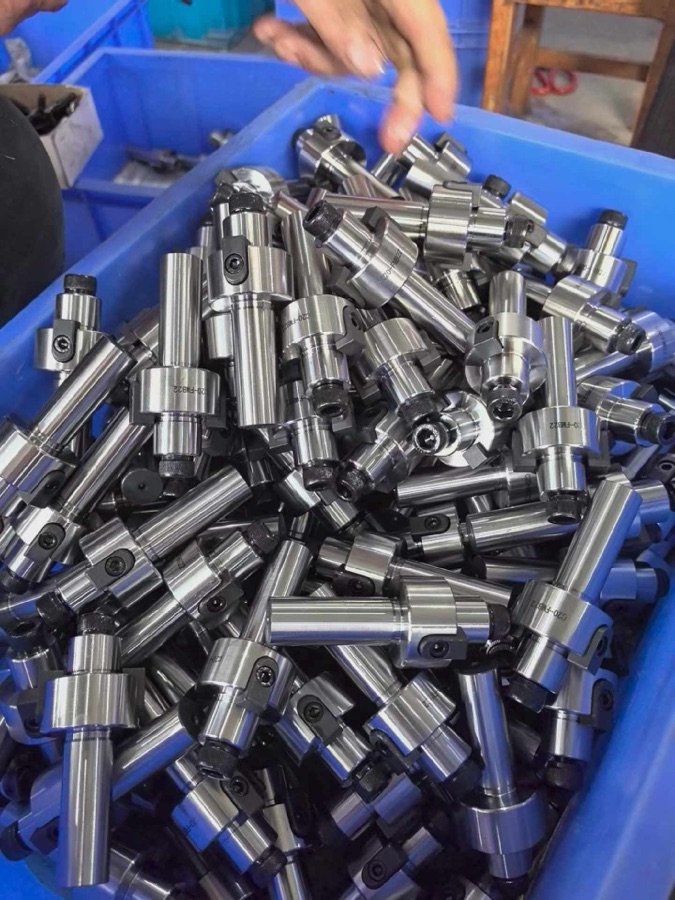 ZSCNC machined parts in blue stock bin